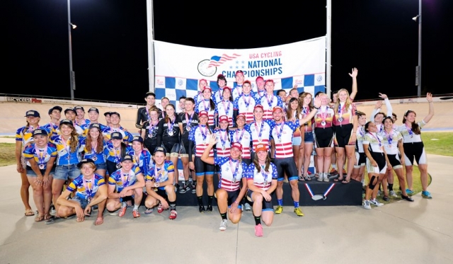 Marian stands atop the podium after defending their omnium title from 2011